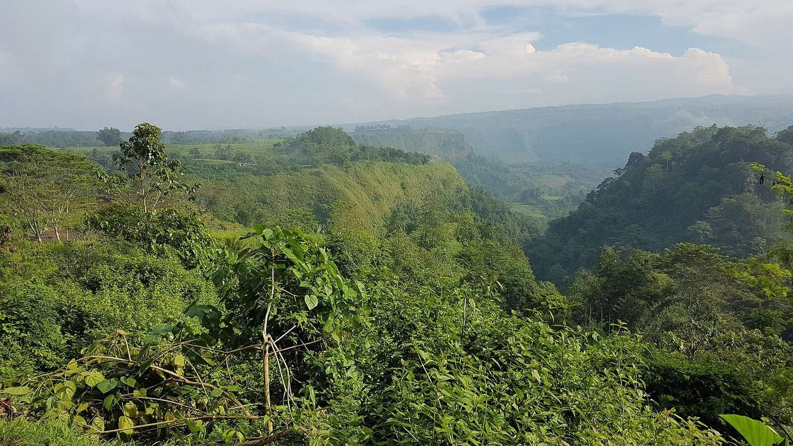 Green hills and gorge of Mangima Canyon in Manolo Fortich, Bukidnon, Philippines