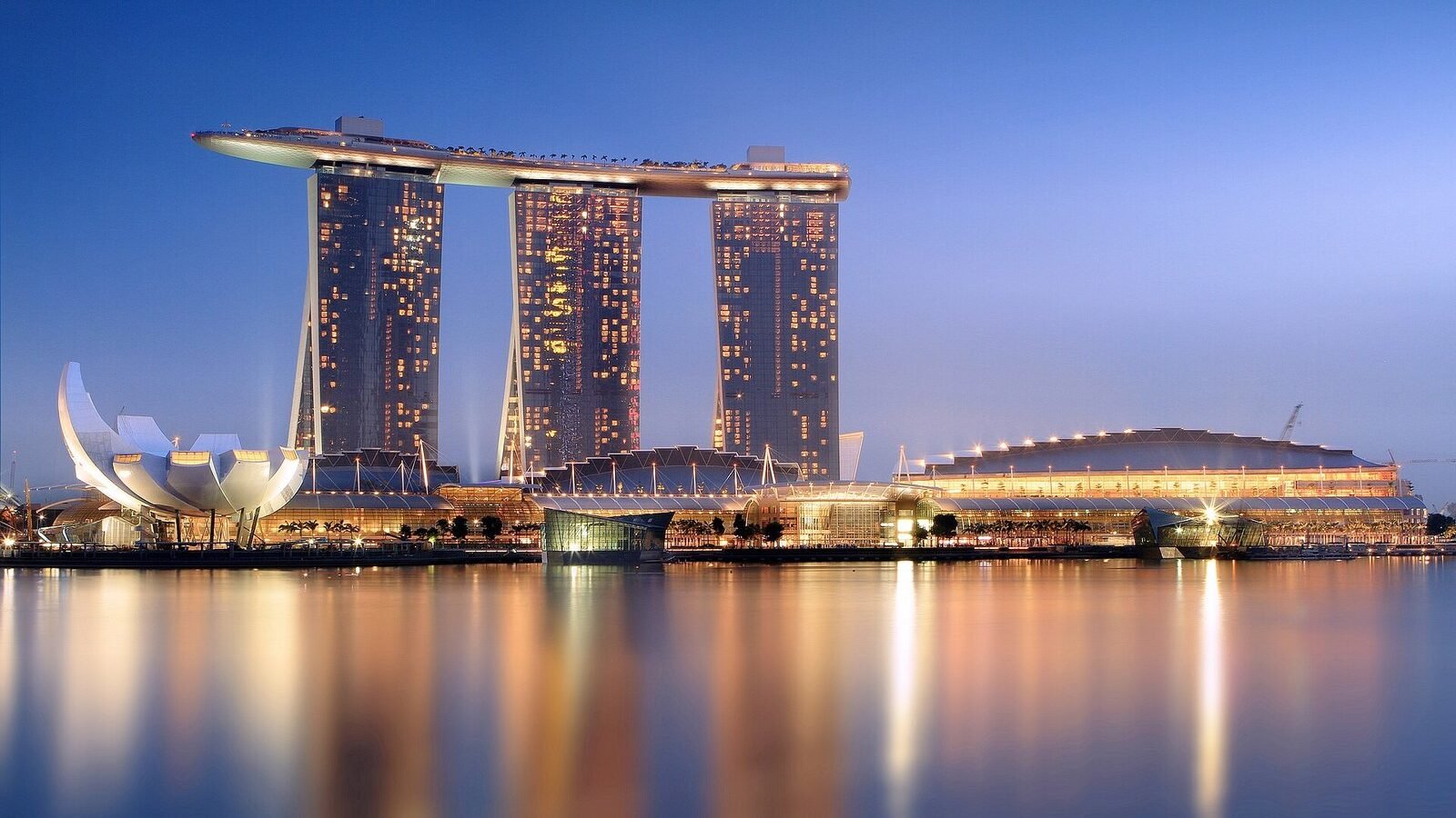 Marina Bay Sands and the ArtScience Museum reflected in Marina Bay at dusk, Singapore