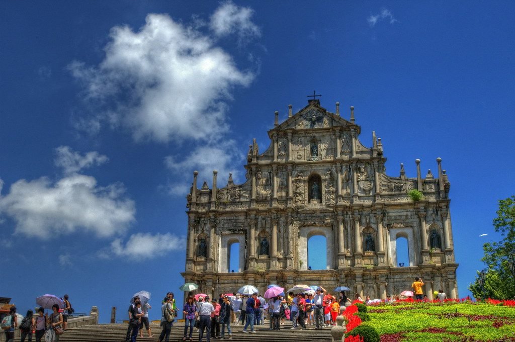 The stone facade of the Ruins of St Paul's against a blue sky in Macau