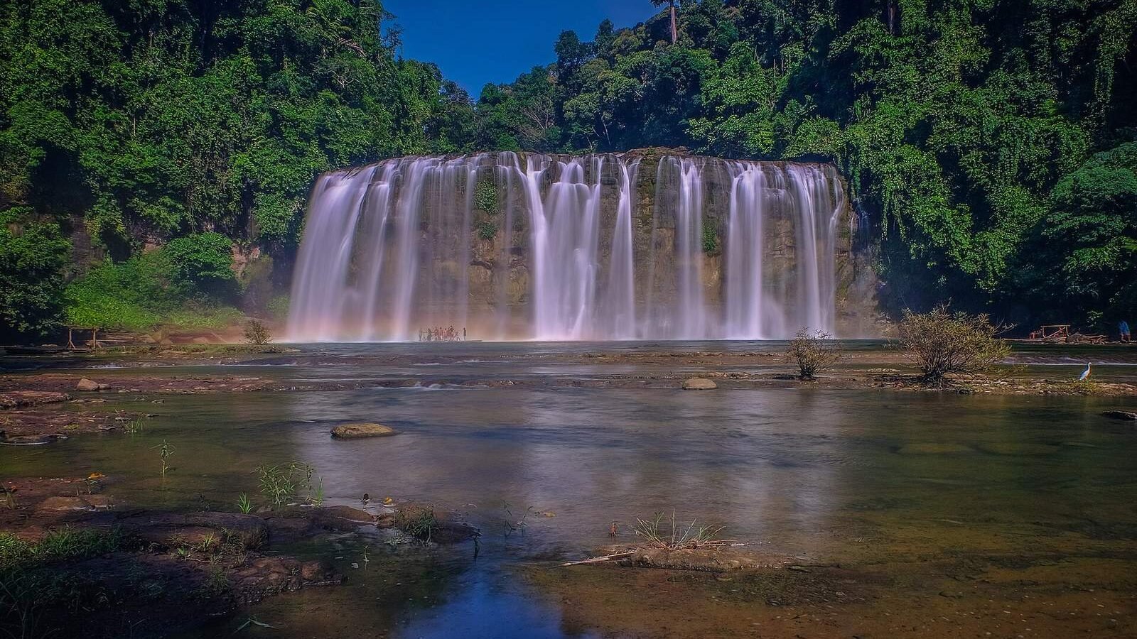 The wide curtain of Tinuy-an Falls dropping into a pool at Bislig, Surigao del Sur, Philippines